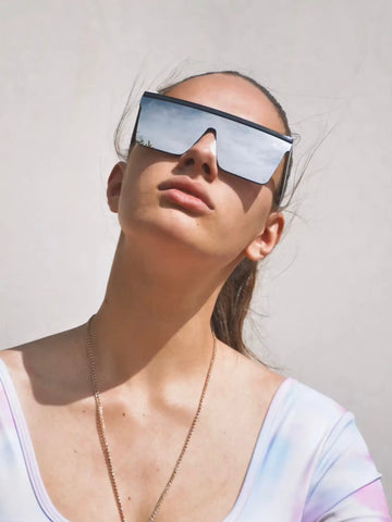 Futuristic shield-style sunglasses with a metallic reflective lens.